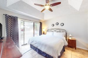 a bedroom with a bed and a ceiling fan at Camp Warnecke Estates Unit B104 in New Braunfels