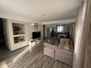 a living room with a couch and a tv at Raj Adventures Hideaway - 7 Cascades in Vacoas