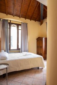 a bedroom with a large bed and a window at Levanto Charme apartment up to 6ppl 20 steps to the water in the center in Levanto