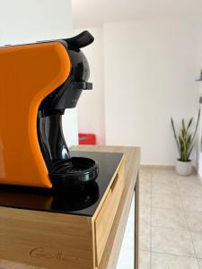 a black mixer sitting on top of a counter at Il Canto Quinto in Acquaviva delle Fonti +5 photos