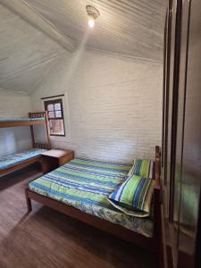 a bedroom with a bed in a room at Pousada Recreio Girassol in São Roque +64 photos