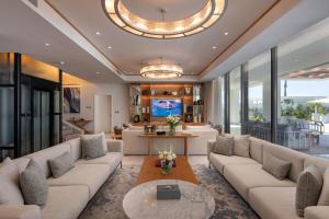 a living room with a couch and a table at Palace Beach Resort in El Alamein