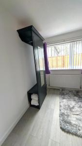 Μια τηλεόραση ή/και κέντρο ψυχαγωγίας στο Tŷ Cefn at The Lodge