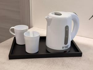Příslušenství pro přípravu čaje a kávy v ubytování Belvedere Lacinio Guest House