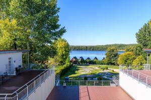 a view of a golf course from the balcony of a house at Eisvogel Classic 301 in Granzow