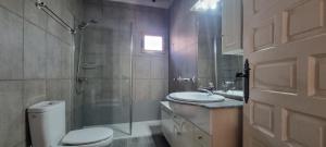 a bathroom with a toilet and a shower and a sink at El Porche de Calabardina Playa - By Aloha Palma in Calabardina