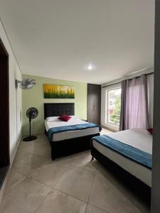 Ένα ή περισσότερα κρεβάτια σε δωμάτιο στο Amoblado laureles San Joaquín