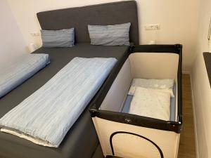 two bunk beds in a small room with a baby at Fewo Grafenblick in Balingen