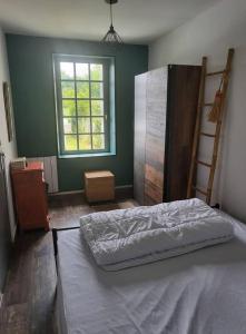 Postel nebo postele na pokoji v ubytování Maison de bourg à 5 minutes de Soulac Sur Mer