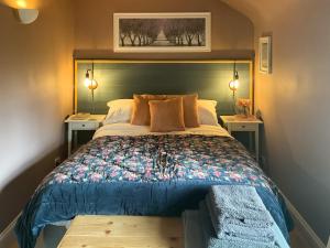 Un ou plusieurs lits dans un hébergement de l'établissement Archers Cottage 5 autres photos