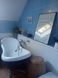 a bathroom with a toilet and a sink and a mirror at Útulné zátišie v zoborskom dome in Nitra