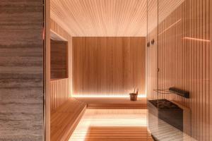 a bathroom with a shower and a wooden floor at Adoro Hotel in Rome +99 photos