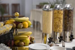 a display of fruit and other food on a table at Hotiday Diano Marina in Diano Marina