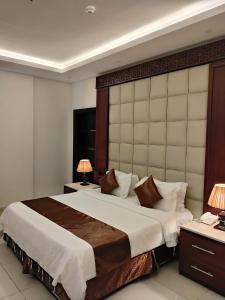 Ένα ή περισσότερα κρεβάτια σε δωμάτιο στο جراند خيال للشقق المخدومه