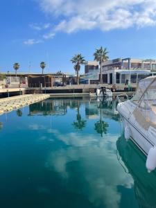 a boat is docked in the water in a marina at Villa balcones in Los Altos