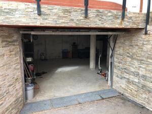 an empty garage with a brick wall at Villa balcones in Los Altos