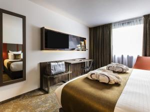 Postel nebo postele na pokoji v ubytování Mercure Belfort Centre