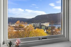 a window with a view of a city at Fjellheim Kurs- og Misjonssenter in Tromsø