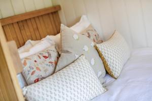 a bed with several pillows on top of it at 1 Bed in Cowling oc-s30772 in Cowling
