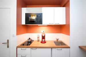a kitchen with a counter top with a blender on it at Suite romantique avec Spa in La Celle-sous-Gouzon