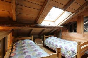 Postel nebo postele na pokoji v ubytování Chalet Evasion Bréda