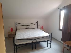 Ένα ή περισσότερα κρεβάτια σε δωμάτιο στο Case vacanze Baia Luna