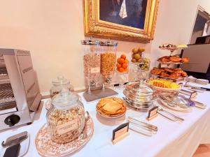 a table with a buffet of food on it at Hôtel de la Poste à Avallon, Bourgogne in Avallon