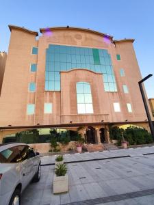 a car parked in front of a building at APARTMENT near GULF DELMON in Dammam