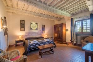 Ένα ή περισσότερα κρεβάτια σε δωμάτιο στο Casale Rosennano - Riserva