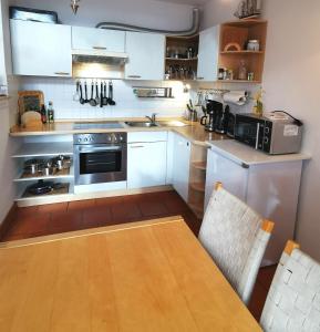 Kuchyň nebo kuchyňský kout v ubytování Unsere Perle mit Sauna