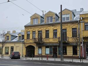 a yellow building on the side of a street at Luxury center in Kaunas