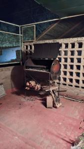 a grill with some food on it next to a fence at Department RJ in San Rafael
