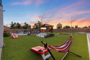 a yard with a hammock and a gazebo at Luxury 6BR Retreat - Pool BBQ Theater and Games in Lemontree
