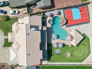 an aerial view of a building with a swimming pool at Luxury 6BR Retreat - Pool BBQ Theater and Games in Lemontree +56 photos