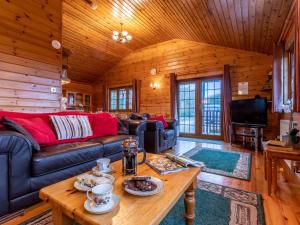 a living room with a couch and a table at 4 Bed in Clovelly 00356 in Clovelly