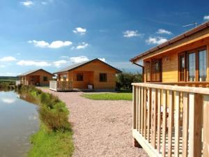 a house with a porch next to a river at 3 Bed in Clovelly 00359 in Clovelly