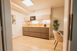 Η κουζίνα ή μικρή κουζίνα στο CityBeat Apartments, 400m from the square