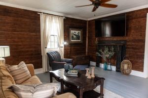 a living room with a couch and a table at Little Noone in Jackson