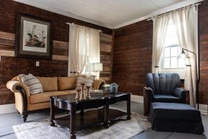 a living room with a couch and a table at Little Noone in Jackson