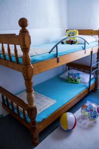two bunk beds in a room with a ball at Apartments "I & I" in Pag +54 photos