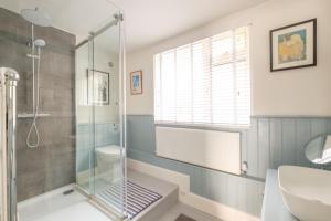 a bathroom with a shower and a sink at Penrose in Downderry +11 photos