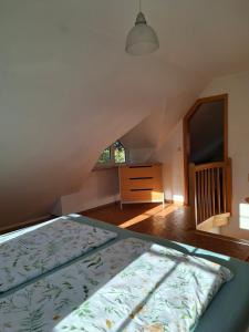 a bedroom with a bed and a window at Haus am Ponyhof in Aurich