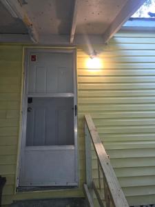a door on the side of a house at Mellow Yellow in Jackson