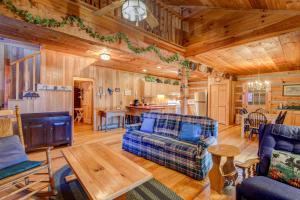a living room with a couch and a table at On The River in Banner Elk