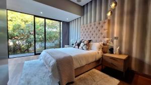 Ένα ή περισσότερα κρεβάτια σε δωμάτιο στο The Sapphire Guesthouse