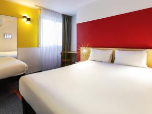 Postel nebo postele na pokoji v ubytování greet Hotel Nancy Sud + 61 fotografií