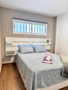 a bedroom with a large bed with a window at Casa Morena in Costa de Antigua