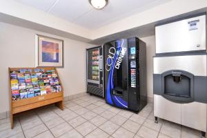 a store with a soda machine next to a vending machine at Red Roof Inn Milwaukee Airport Oak Creek in Oak Creek