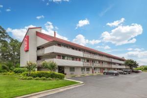 a hotel with a parking lot in front of it at Red Roof Inn Durham - Duke Univ Medical Center in Durham