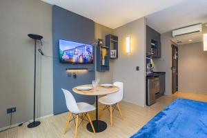 TV a/nebo společenská místnost v ubytování Flats Prime – Alpha Stay | Alphaville – Barueri – SP